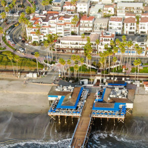 Couple enjoying the pier while staying at San Clemente Cove