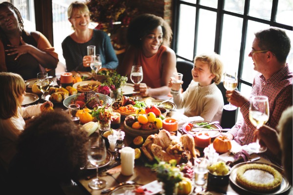 family gathered around the table for thanksgiving meal